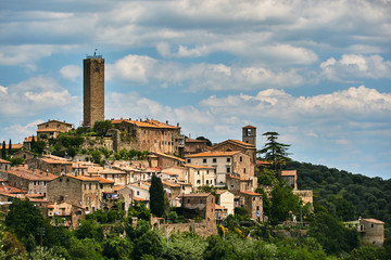 Fototapeta na wymiar brick, medieval tower and belfry of the city of Pereta in Tuscany.