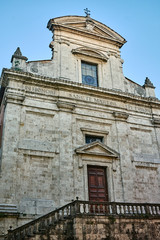 Fototapeta na wymiar Facade of a historic church in Grosseto, Italy.