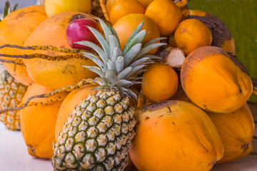 fruits in a basket, bunch of cocos
