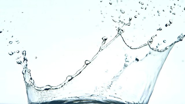 Super Slow Motion Shot of Water Splash at 1000fps on White Background. Shooted with High Speed Cinema Camera at 4K.