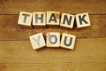 Thank You alphabet letters on wooden background