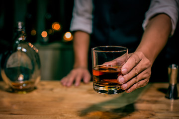 Barman pouring whiskey whiskey glass beautiful night