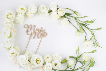 white flowers are lined with a frame and the inscription Mr. and Mrs.