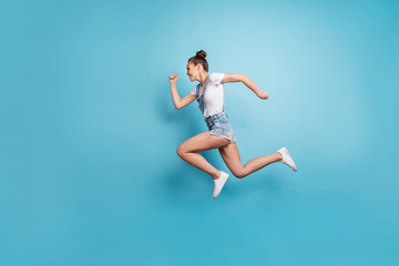 Fototapeta na wymiar Full length body size photo of girlfriend running as quick as she can while isolated with blue background