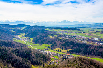 Fototapeta premium Panorama of alps and towns Wettswil, Stallikon and Bonstetten from odservation tower on Uetliberg mountain