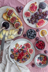 Obraz na płótnie Canvas Breakfast with fruit, cheese, yogurt, granola and jam.