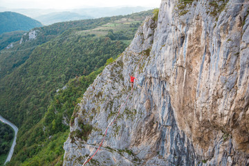 A man walks confidently along the highline.
