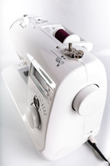 Sewing machine. Threads wound on a bobbin.