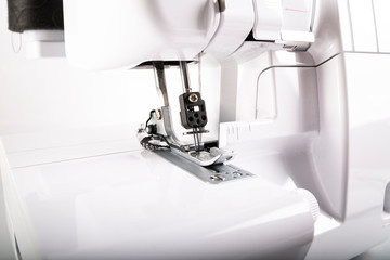 Sewing machine foot. Professional modern sewing machine.