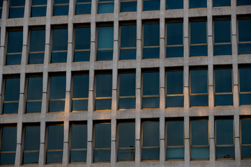 The background of the window of a multi-storey building is shot closeup.