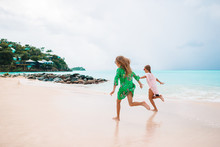 Kids have a lot of fun at tropical beach playing together