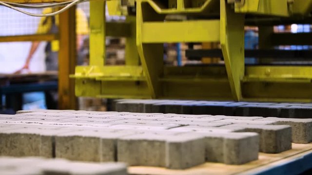 Production Line Inside A Road Pavement Factory. Interlocked Pavement Blocks