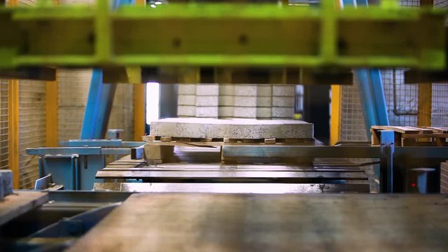 Production Line Inside A Road Pavement Factory. Interlocked Pavement Blocks