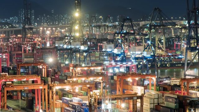 Shipping containers on dock container terminal Container shipyard at Night timelapse
