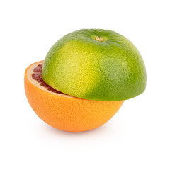 Fresh orange and green grapefruit / pomelo half cut into two equal parts with a juicy red pulp. Isolated on white background. Side view.