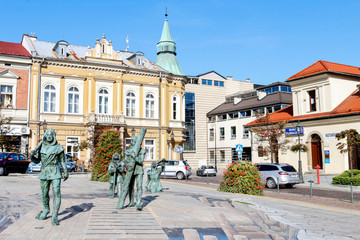 Naklejka premium WIELICZKA - SEMTEMBER 11, 2019: Monument of medieval salt mine worker at the main market square