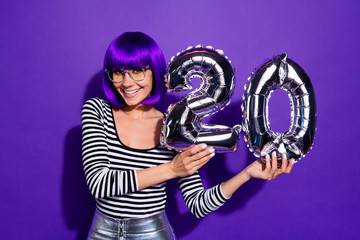 Photo of amazing lady hold hands ballons celebrate 20 year party wear specs striped pullover...