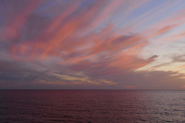 Sunset in Alghero, Sardinia, Italy. Colorful seascape on a summer night.