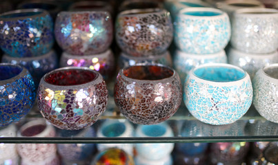 Multi-colored glasses on the counter in the market