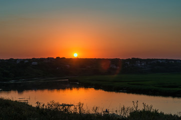 low red sunset over river