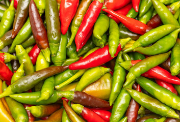 Red and green chili peppers as a background