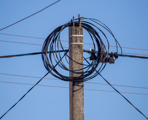Electric pole against the blue sky