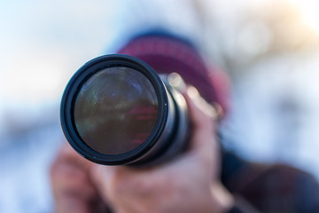 Professional camera in the hands of a man