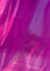 Red silk fabric as an abstract background