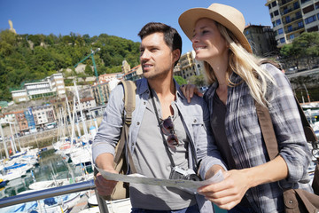 Couple of tourists standing by marina