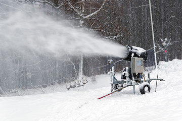 Snow cannon on the ski slope.