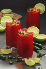 Jalapeno tomato margarita cocktail with lime	