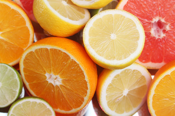 Mix of citrus fruits cut in different forms	