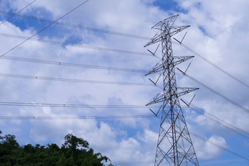 Electrical tower station wiring power with cloudy and blue sky background, High voltage station post