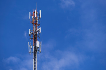 Telecommunication telephone signal transmission tower with beautiful blue sky and cloudy background