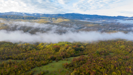 Caucasus Mountains, morning in the mountains, fog over the forest, a beautiful view of the mountains from a bird's eye view