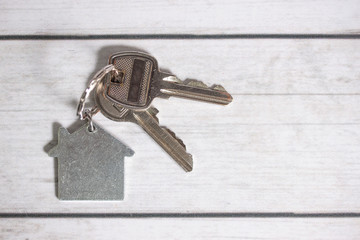 House key on wooden background