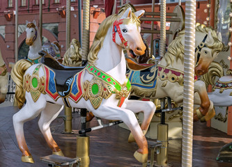 Fototapeta na wymiar Horse in vintage style on a children's carousel.
