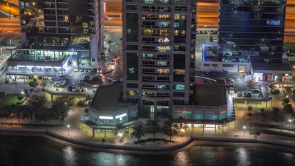 Residential and office buildings in Jumeirah lake towers district night timelapse in Dubai