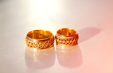 Wedding rings on a white backround.