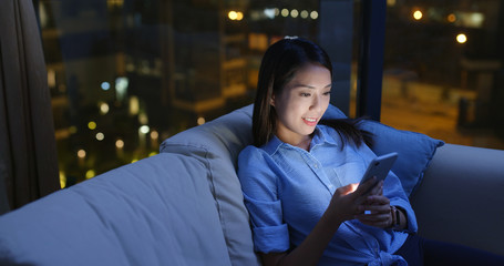 Woman work on mobile phone at home