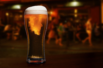 glass of beer on a street bar table.
