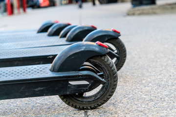 Electric Scooter wheels on a city pavement