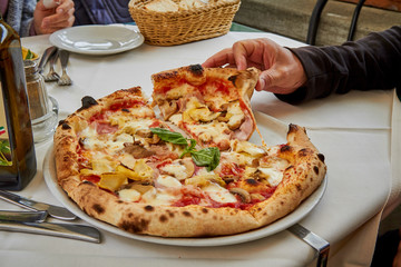 Italian pizza in a restaurant on the table