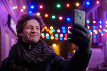 Man making selfie on a cold winter evening