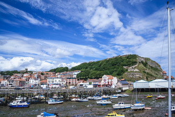Fototapeta na wymiar Looking towards Scarborough Castle from the Old Pier, Scarborough Harbour, Yorkshire, England, UK.