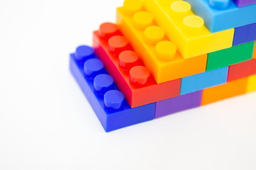 Fototapeta premium brick blocks stairs cube toy mini figures colorful on white background . building plastic fun collection for child .