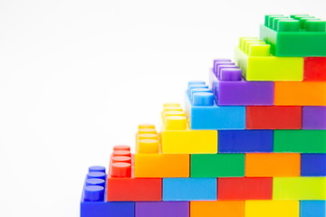 brick blocks stairs cube toy mini figures colorful on white background . building plastic fun collection for child .