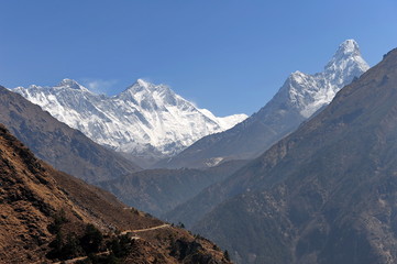 Fototapeta premium Panorama of the Himalayas. The tops of the mountains. Trekking to Gokyo Mountain. Rocky mountains dug in by snow and ice.