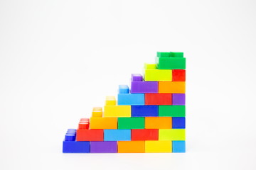 brick blocks stairs cube toy mini figures colorful on white background . building plastic fun collection for child .