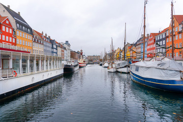 Denmark. The most popular promenade in Copenhagen is Nyhavn. Bright multi-colored facades of old houses.